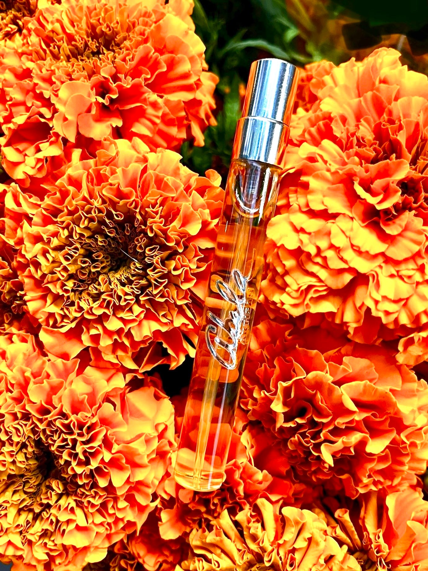Perfume bottle with orange flowers