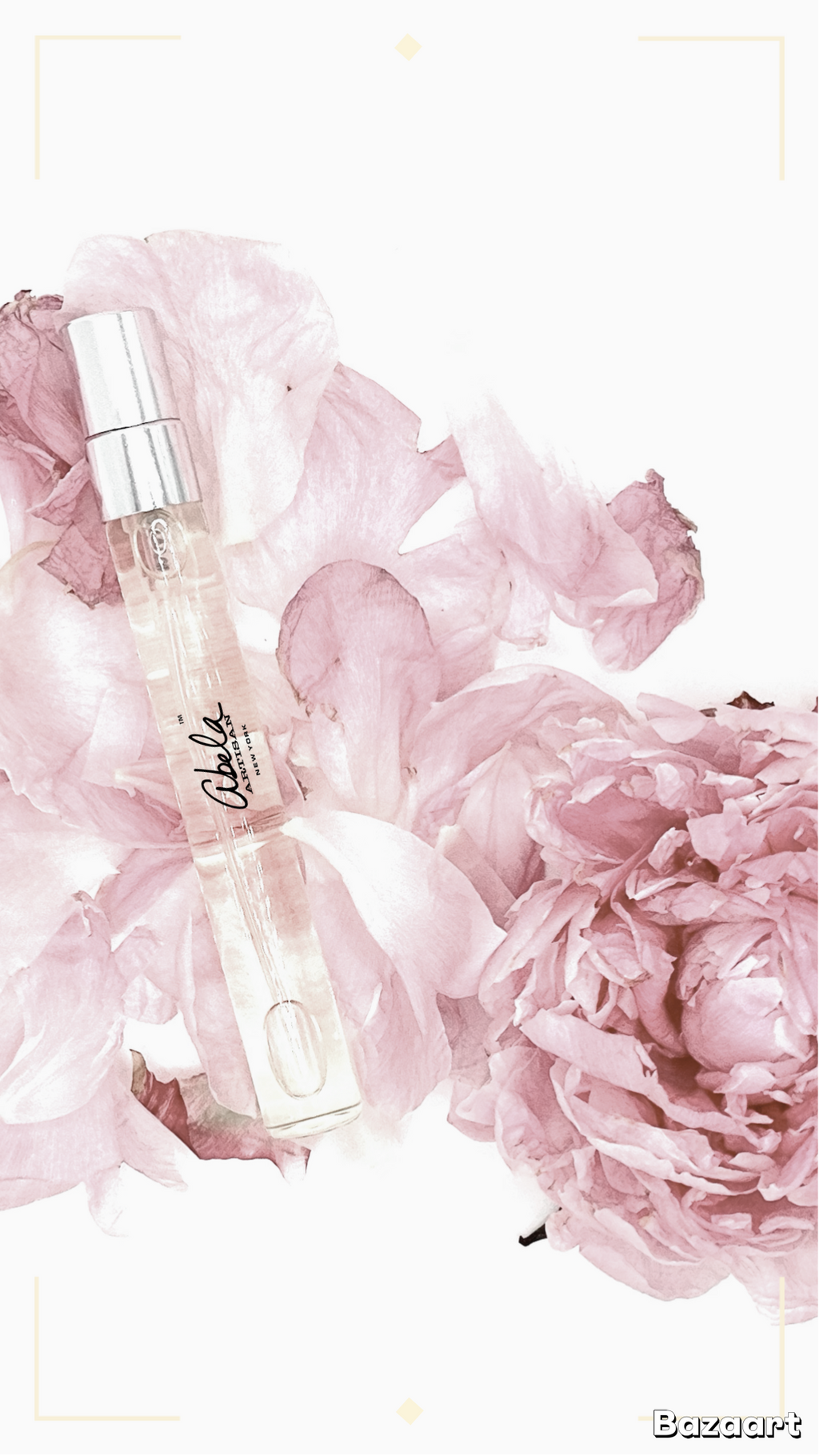 Perfume vial 
bottle with pink flowers on a light background